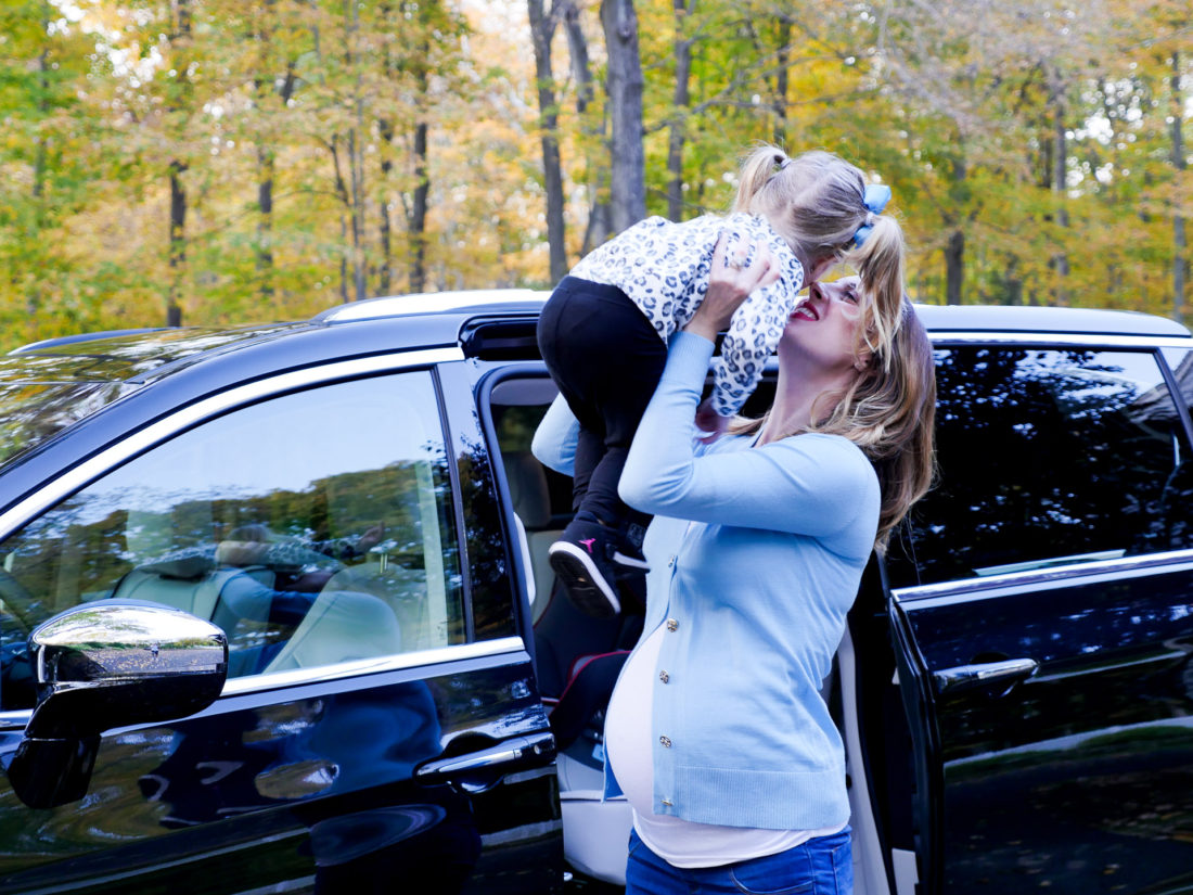 Brenda Mierish Martino pictured at nine months pregnant, lifting daughter Marlowe in to the air