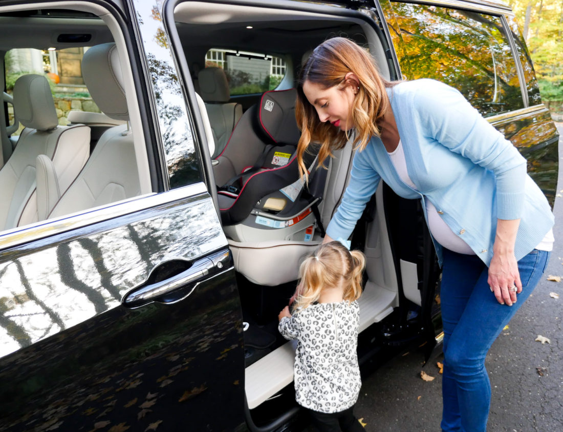 Brenda Mierish Martino pictured using the attached vacuum cleaner in her new Chrysler Pacifica