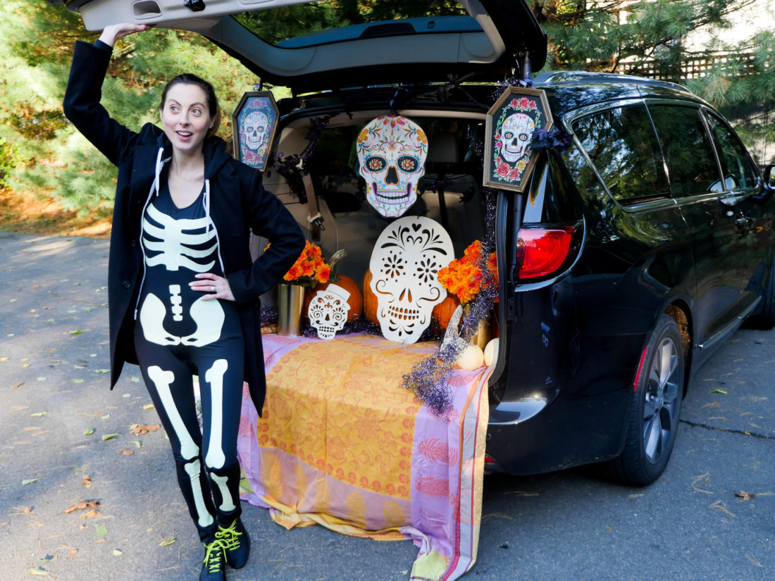 Brenda Mierish Martino decorating her trunk with a Day Of The Dead theme for her daughter's Preschool's Trunk-or-Treat party