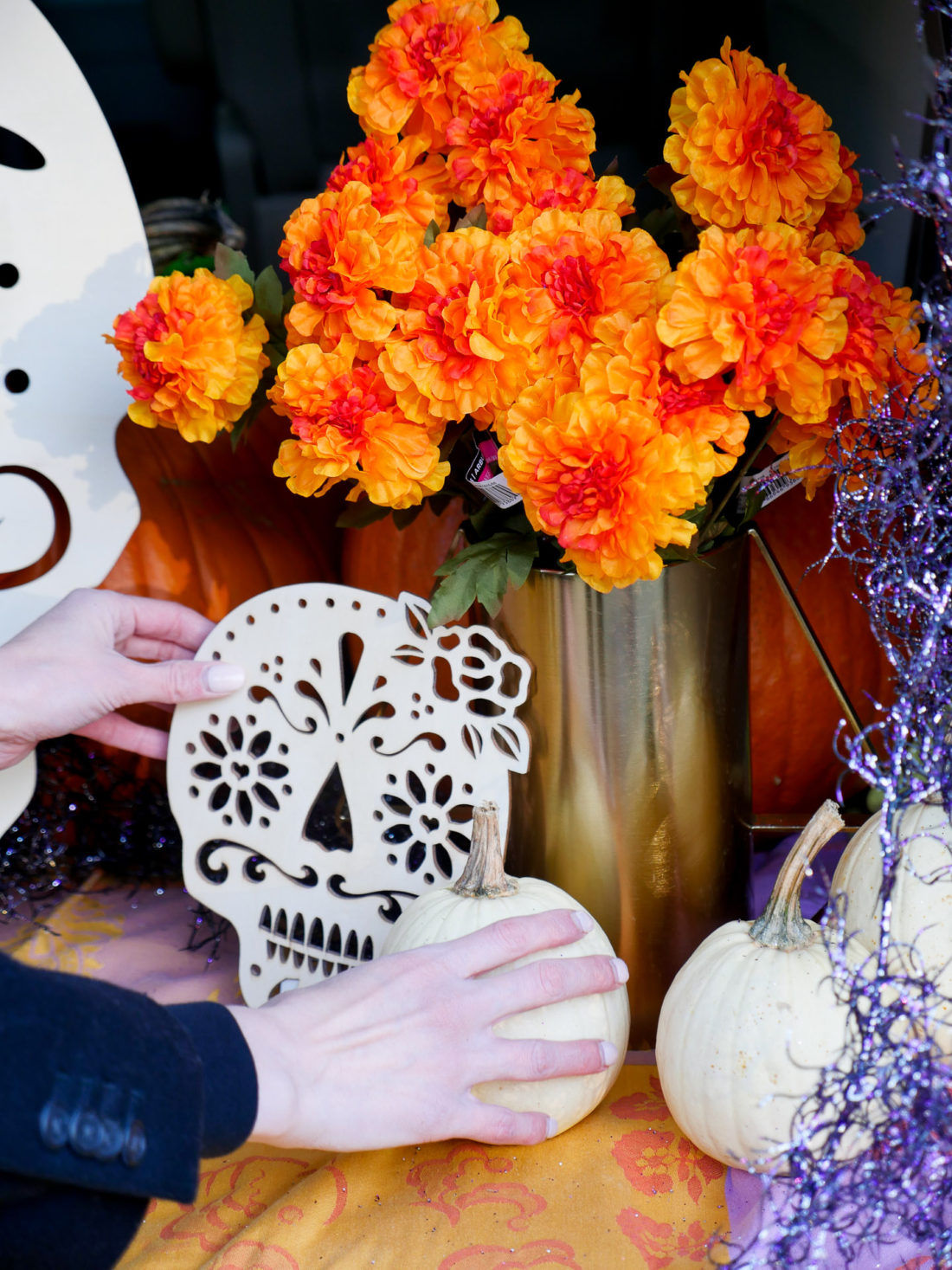 Brenda Mierish Martino decorating her trunk with a Day Of The Dead theme for her daughter's Preschool's Trunk-or-Treat party