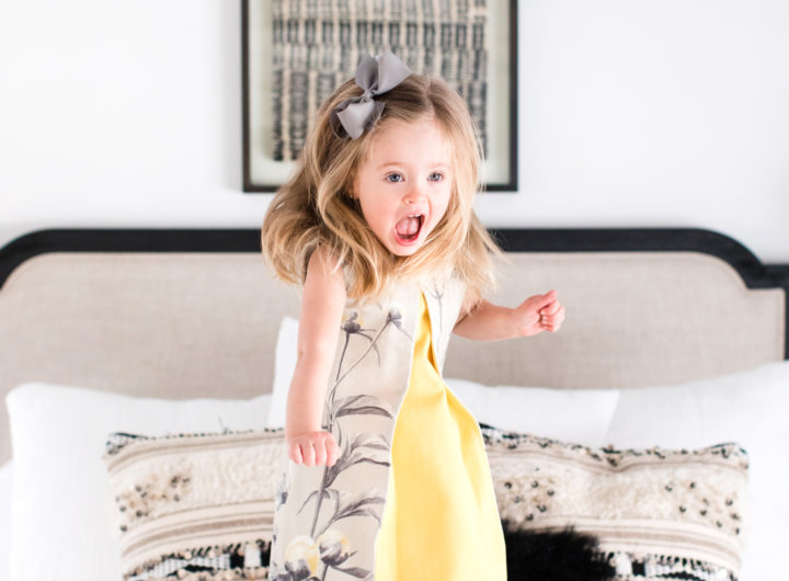 Marlowe Martino jumps happily on her mother's bed
