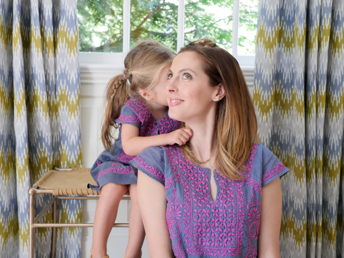 Marlowe Martino whispers a secret in to her Mom's ear