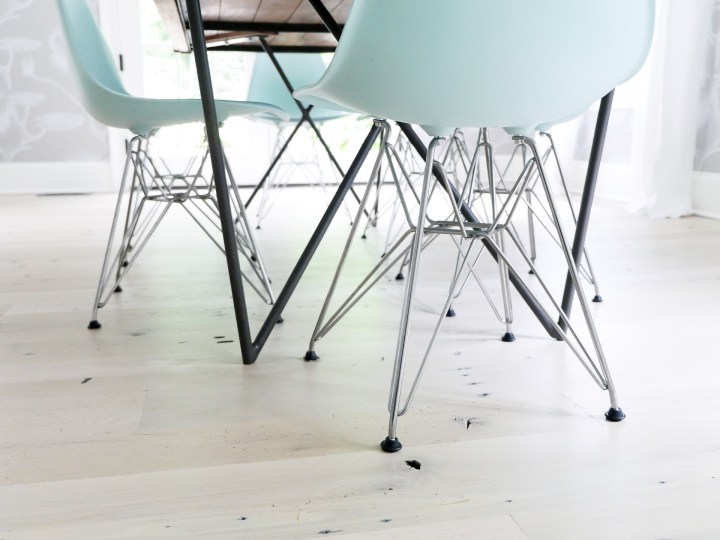 robin's egg blue molded plastic eames chairs in the dining room of Brenda Mierish Martino's Connecticut home