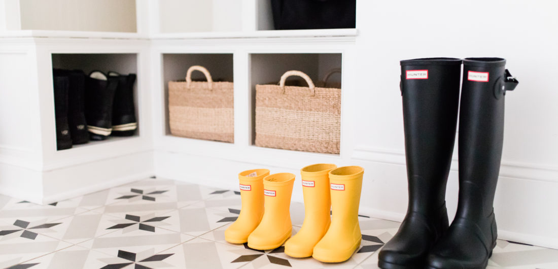 The black and white tiled mud room, with natural woven accents, in Brenda Mierish Martino's Connecticut home