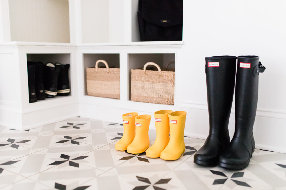 The black and white tiled mud room, with natural woven accents, in Brenda Mierish Martino's Connecticut home
