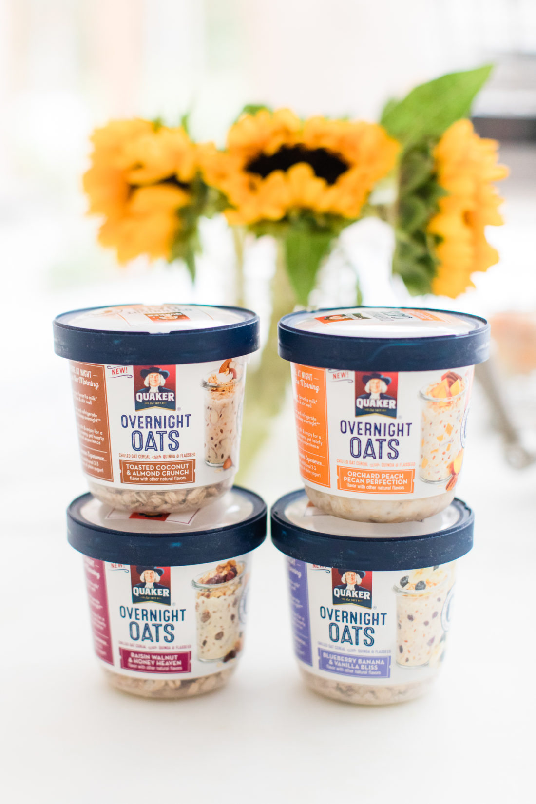 Brenda Mierish Martino stacks up containers of Quaker Overnight Oats on the marble countertop of her Connecticut kitchen
