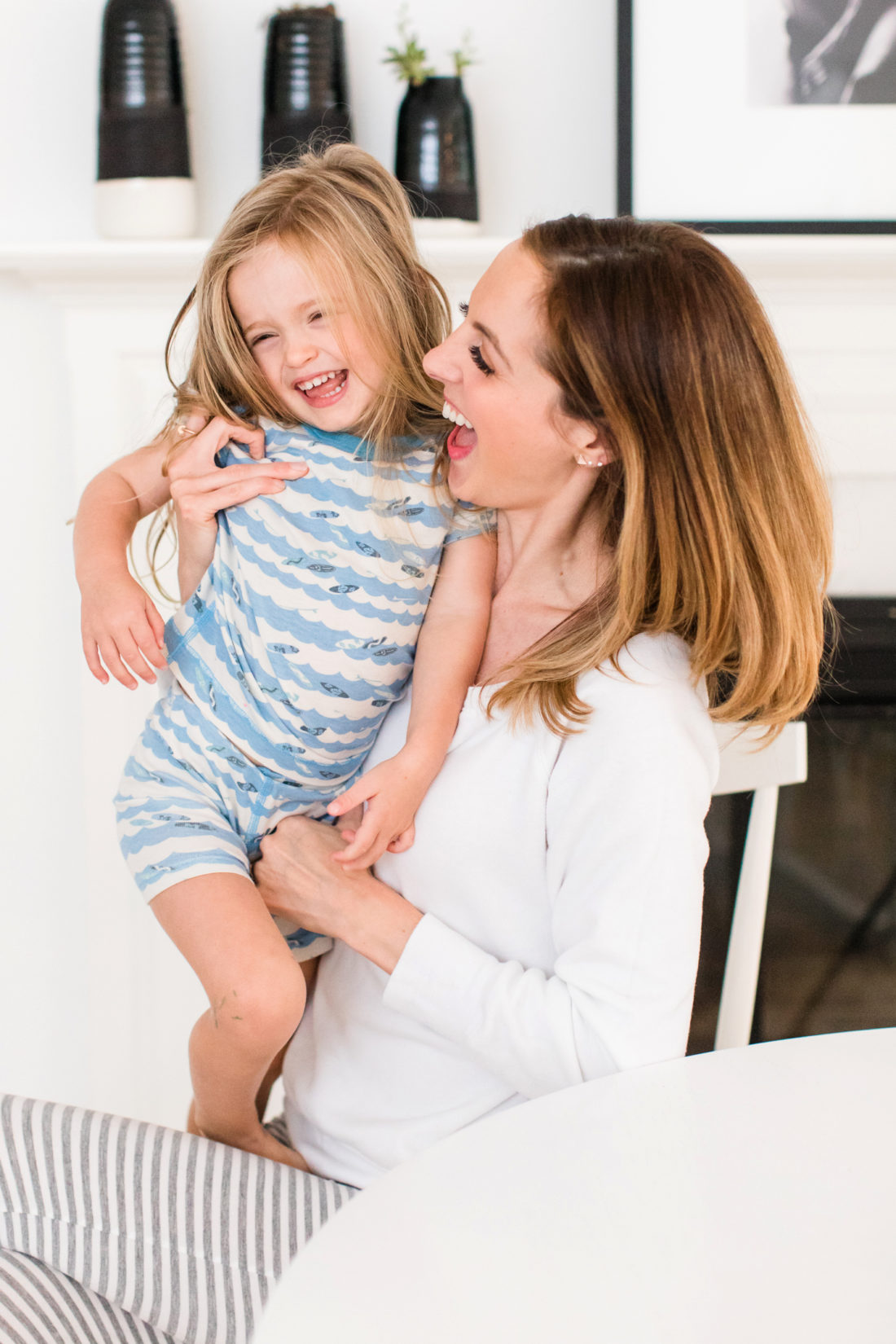 Brenda Mierish Martino tickles daughter marlowe in the morning at the kitchen table in their conecticut home