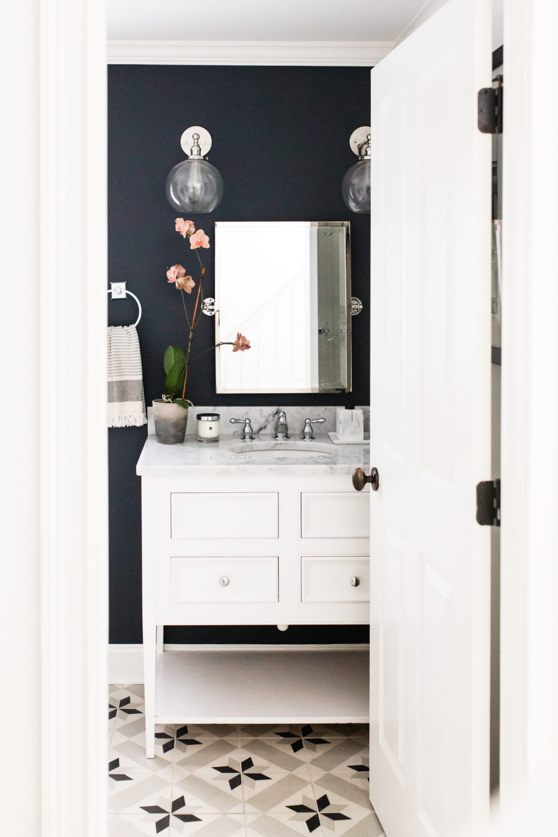 Brenda Mierish Martino shares the black, white, and grey design of the powder room in her Connecticut home