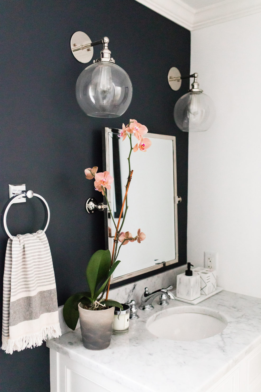 Brenda Mierish Martino shares the full redesign of her black, white, and grey concept powder room in her Connecticut home