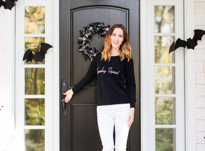 Brenda Mierish Martino stands at the entryway to her Connecticut home that is decorated with a spooky bat theme for Halloween
