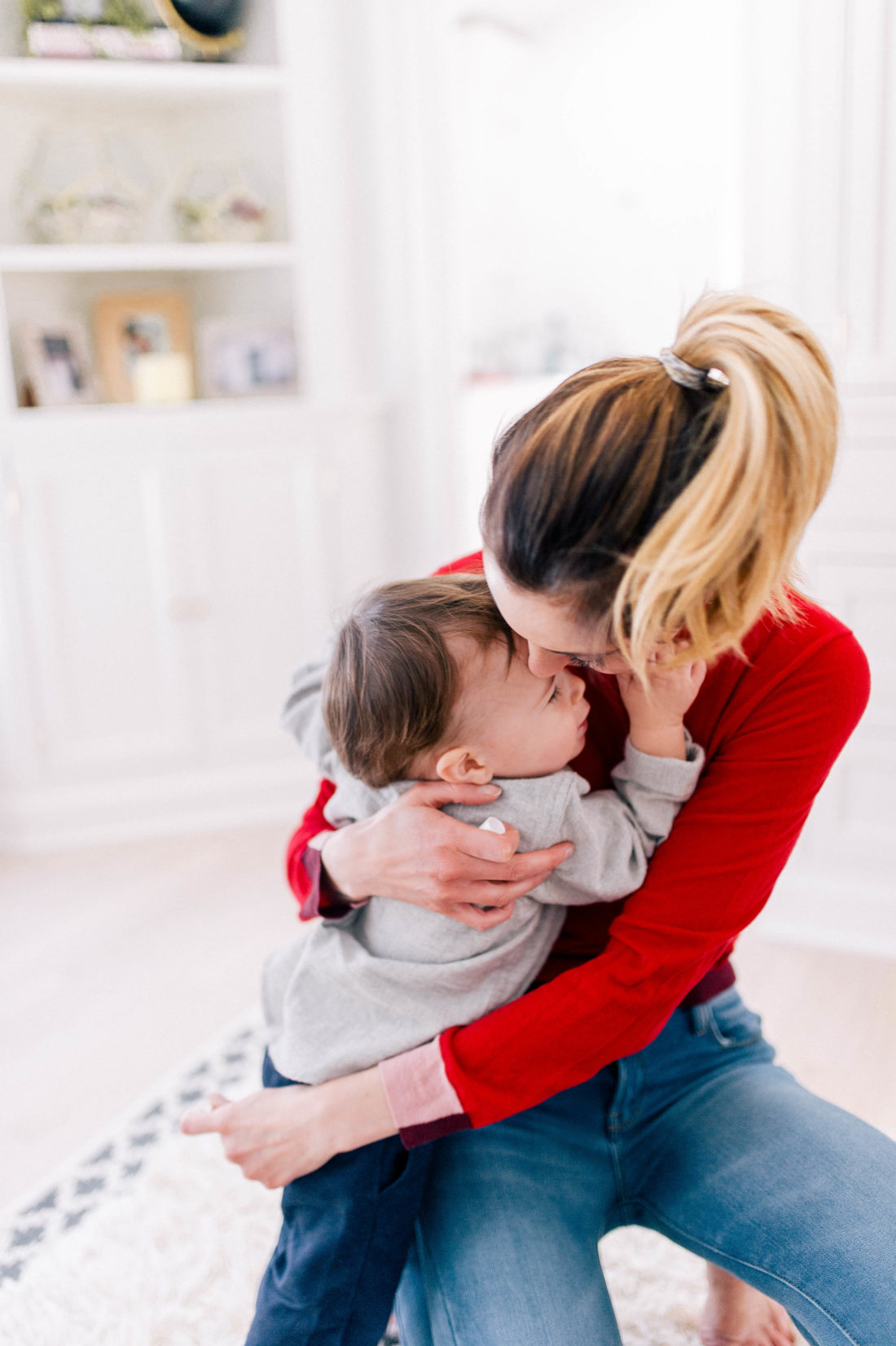 Brenda Mierish Martino snuggles one year old son Major before getting him ready for bath time
