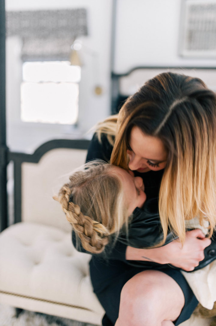 Brenda Mierish Martino gives her daughter Marlowe Mae a big kiss on the forehead in their Connecticut home.