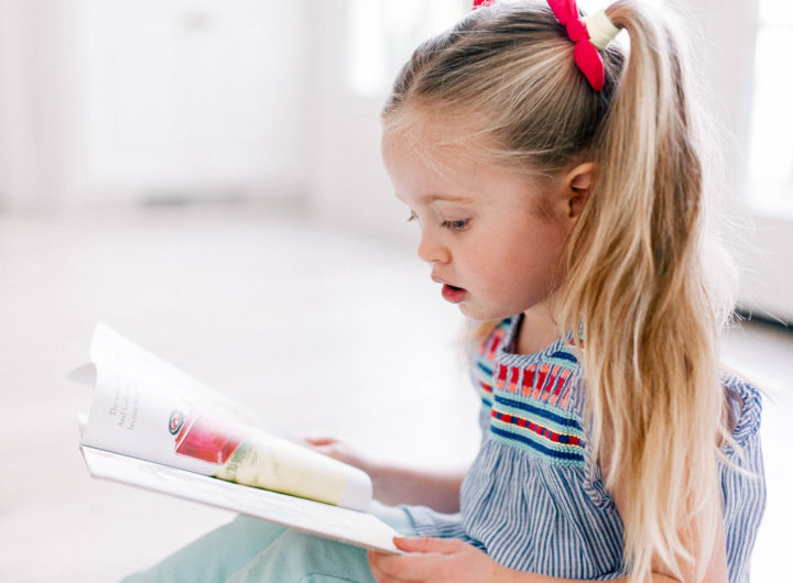 Brenda Mierish's daughter Marlowe reads one of her favorite kids' book on the kitchen floor of her Connecticut home.