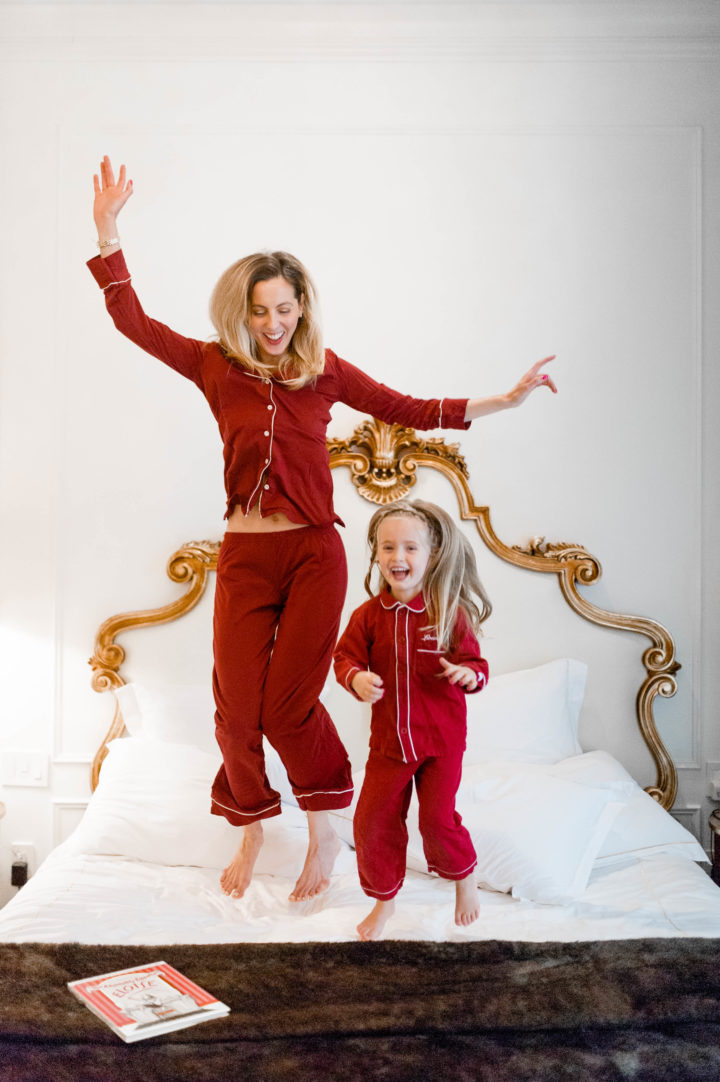 Brenda Mierish Martino jumps on the bed at the Plaza Hotel in New York City with her daughter Marlowe
