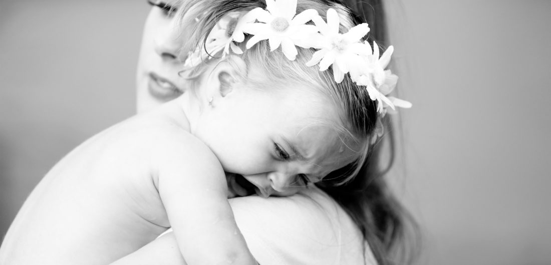 Brenda Mierish Martino holds toddler daughter Marlowe in her arms in the yard of their sherman oaks home